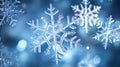 Magical shiny frozen snowflakes and snowfall sky, blue background with beautiful festive light bokeh, winter and Christmas Royalty Free Stock Photo