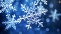 Magical shiny frozen snowflakes and snowfall sky, blue background with beautiful festive light bokeh, winter and Christmas Royalty Free Stock Photo