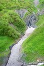 Magical small waterfall in a mountain gorge Royalty Free Stock Photo