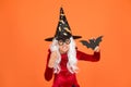Magical spell. Small witch with white hair. Wizard or magician. Halloween party. Photo booth props. Small girl in black Royalty Free Stock Photo