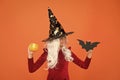 Magical spell. Small witch with white hair. Wizard or magician. Halloween party. Small girl in black witch hat. Autumn Royalty Free Stock Photo