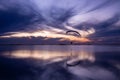 Magical sunset in the lagoon while a paraglider flies over it