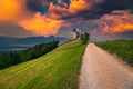 Amazing sunset landscape with Saint Primoz church, near Jamnik, Slovenia Royalty Free Stock Photo