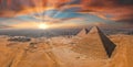 Magical sunset over the Egyptian pyramids. Aerial view of the Pyramids of Giza. Royalty Free Stock Photo