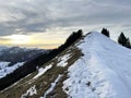 Magical sunset and shy sun behind winter clouds over the Obertoggenburg region and in the Swiss Prealps, UrnÃÂ¤sch / Urnaesch Royalty Free Stock Photo