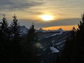 Magical sunset and shy sun behind winter clouds over the Obertoggenburg region and in the Swiss Prealps, UrnÃÂ¤sch / Urnaesch Royalty Free Stock Photo