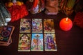 Magical Tarot cards at table, fortune telling concept