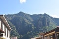Center of town of Tepoztlan in Morelos, with colorful buildings, view of the mountain where the temple of El Tepozteco is located Royalty Free Stock Photo