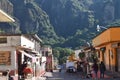 Streets of the center of the town of Tepoztlan in Morelos, with colorful buildings and people walking, view of the mountain where