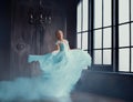 The magical transformation of Cinderella into a beautiful princess in a luxurious dress. Young women are blonde