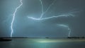 Magical view of a striking lightning over a sea location in a stormy day Royalty Free Stock Photo