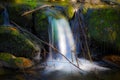 Magical waterfall falling into a river in Galicia in slow motion