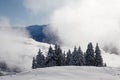 Magical winter landscape with rising fog and the sun against the light in central Switzerland Royalty Free Stock Photo