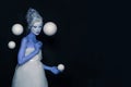 Magical woman with stage makeup and hairstyle standing with white planet spheres on black banner background. Astrology and space Royalty Free Stock Photo