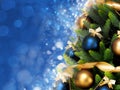 Magically decorated Christmas Tree with balls, ribbons and garlands on a blurred blue shiny background