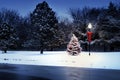 Magically Lit Tree Glows Brightly on Snow Covered Christmas morning Royalty Free Stock Photo