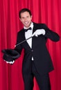A magician in a black suit Royalty Free Stock Photo