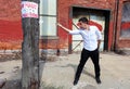 Magician at Detroit Michigan doing street magic in abandoned building at the motor city