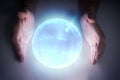 Magician or fortune teller is predicting future with crystal sphere. Royalty Free Stock Photo