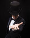 Magician holding something on palm of his hand Royalty Free Stock Photo