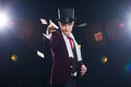 Magician, Juggler man, Funny person, Black magic, Illusion Man showing tricks with cards. threw cards Royalty Free Stock Photo
