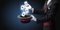 Magician making trick with wand and playing cards Royalty Free Stock Photo