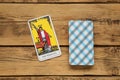 The Magician and other tarot cards on wooden table, flat lay