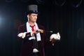 Magician with rabbit, Juggler man, Funny person, Black magic, Illusion on a black background Royalty Free Stock Photo