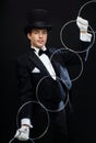 Magician showing trick with linking rings Royalty Free Stock Photo