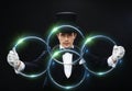 Magician showing trick with linking rings Royalty Free Stock Photo