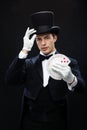 Magician showing trick with playing cards Royalty Free Stock Photo