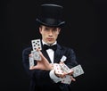 Magician showing trick with playing cards Royalty Free Stock Photo