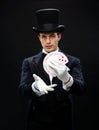 Magician showing trick with playing cards Royalty Free Stock Photo