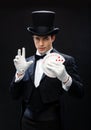 Magician showing trick with playing cards Royalty Free Stock Photo