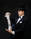Magician showing trick with playing cards Royalty Free Stock Photo
