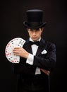 Magician showing trick with playing cards Royalty Free Stock Photo