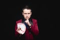 Magician shows trick with playing same cards on dark background. Disclosure of focus Royalty Free Stock Photo