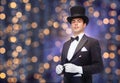 Magician in top hat with magic wand Royalty Free Stock Photo