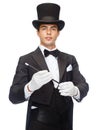 Magician in top hat with magic wand showing trick Royalty Free Stock Photo