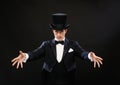 Magician in top hat showing trick