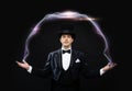 Magician in top hat showing trick Royalty Free Stock Photo