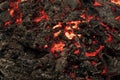 Magma textured molten rock surface. Lava flame on black ash background Royalty Free Stock Photo