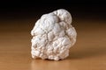 Magnesite mineral from Namibia over a wooden table