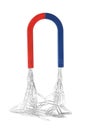 Magnet attracting paper clips on white Royalty Free Stock Photo
