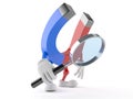 Magnet character looking through magnifying glass