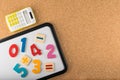 Magnetic board with numbers and calculator. Education concept Royalty Free Stock Photo