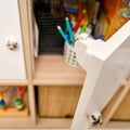 Magnetic child-proof lock for locking cabinet doors and drawers of home furniture