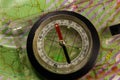 Magnetic compass is located on a topographic map Royalty Free Stock Photo