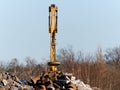 Magnetic crane at a scrap yard at an industrial port Royalty Free Stock Photo