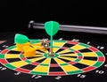 Magnetic dart arrows on dart board. black background Royalty Free Stock Photo